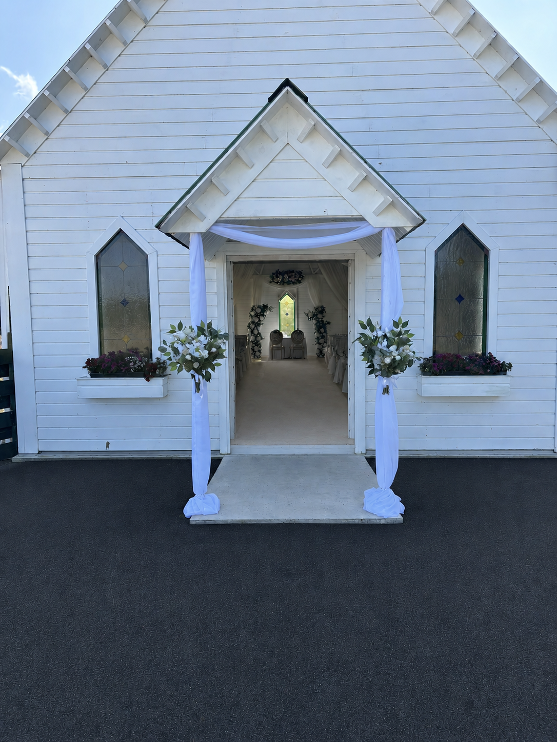 Chapel entrance drape with floral accents