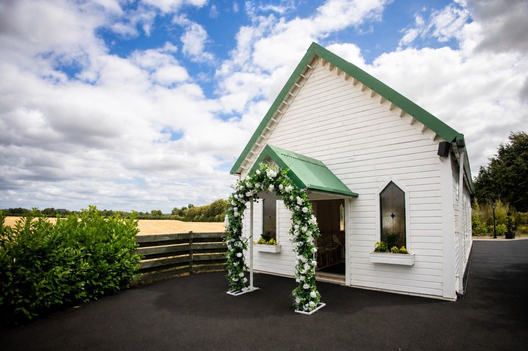 Green and White Curved Arch for Outside Chapel
