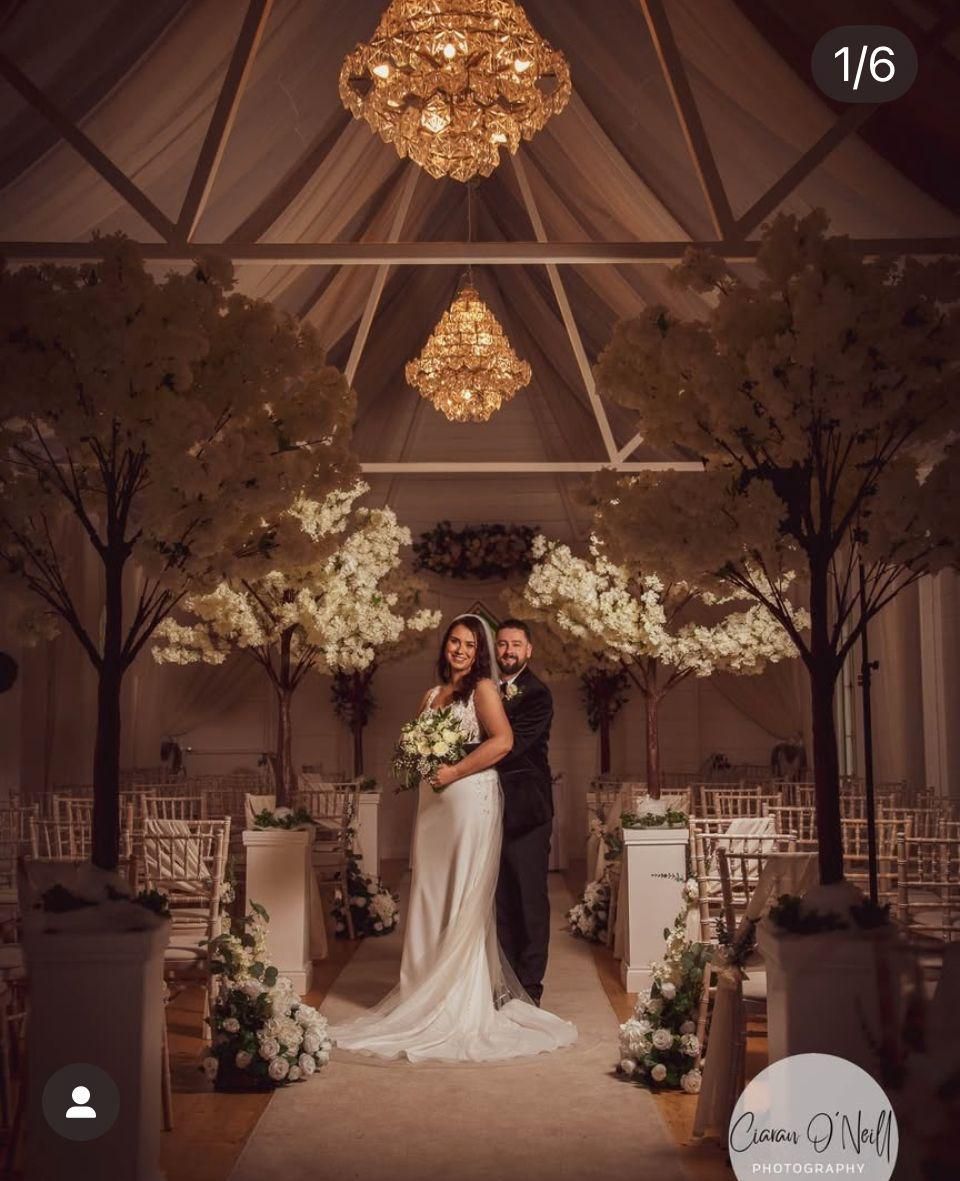 Stunning flower wall backdrop with greenery