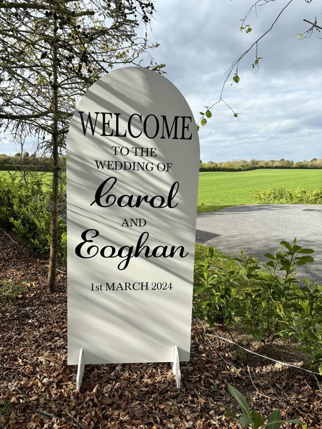 Oval welcome sign with greenery