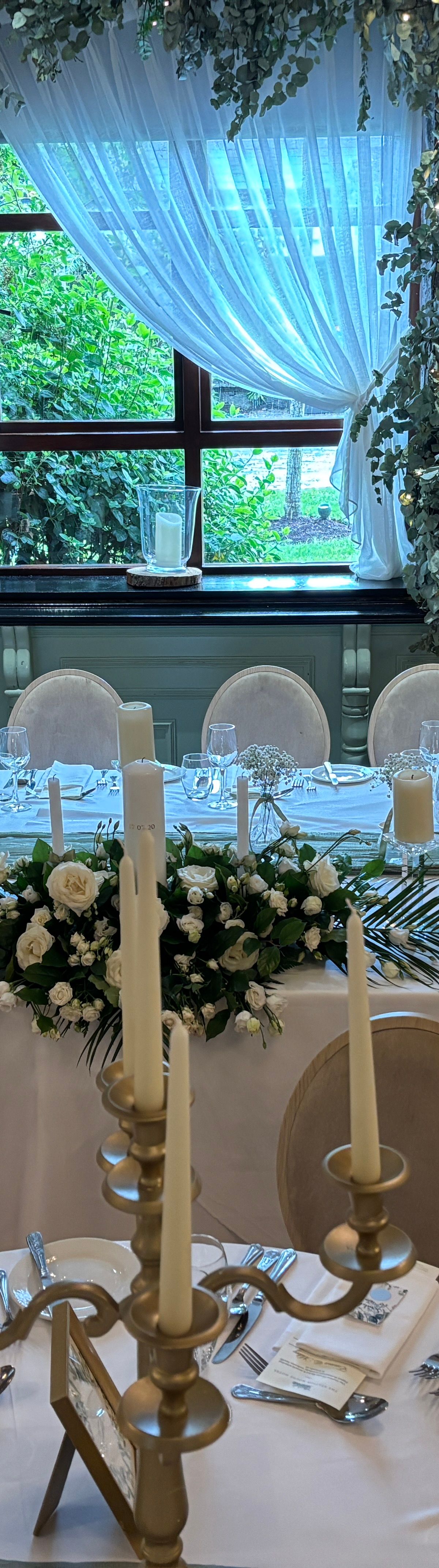 Top table arrangement with cascading flowers