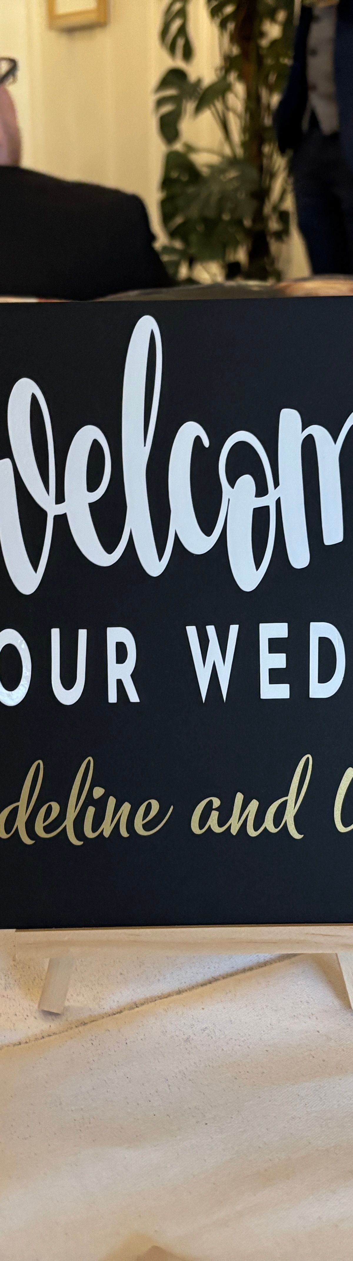 Black and white welcome sign backdrop