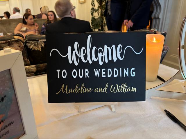 Black and white welcome sign backdrop